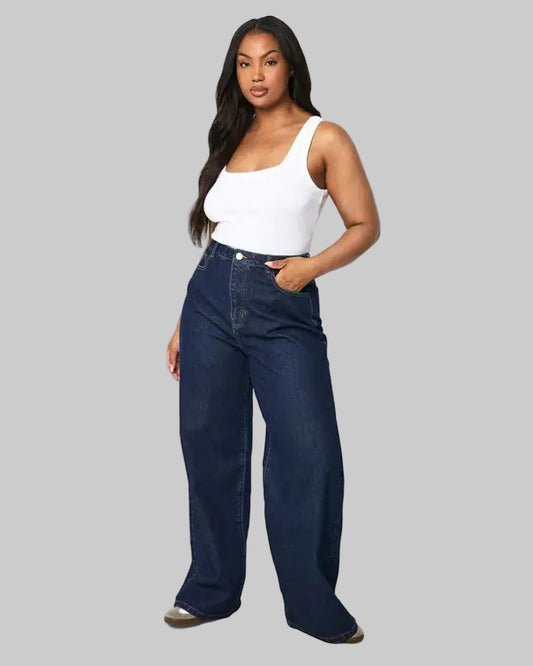 Plus size woman wearing wide leg dark blue denim jeans in a casual look