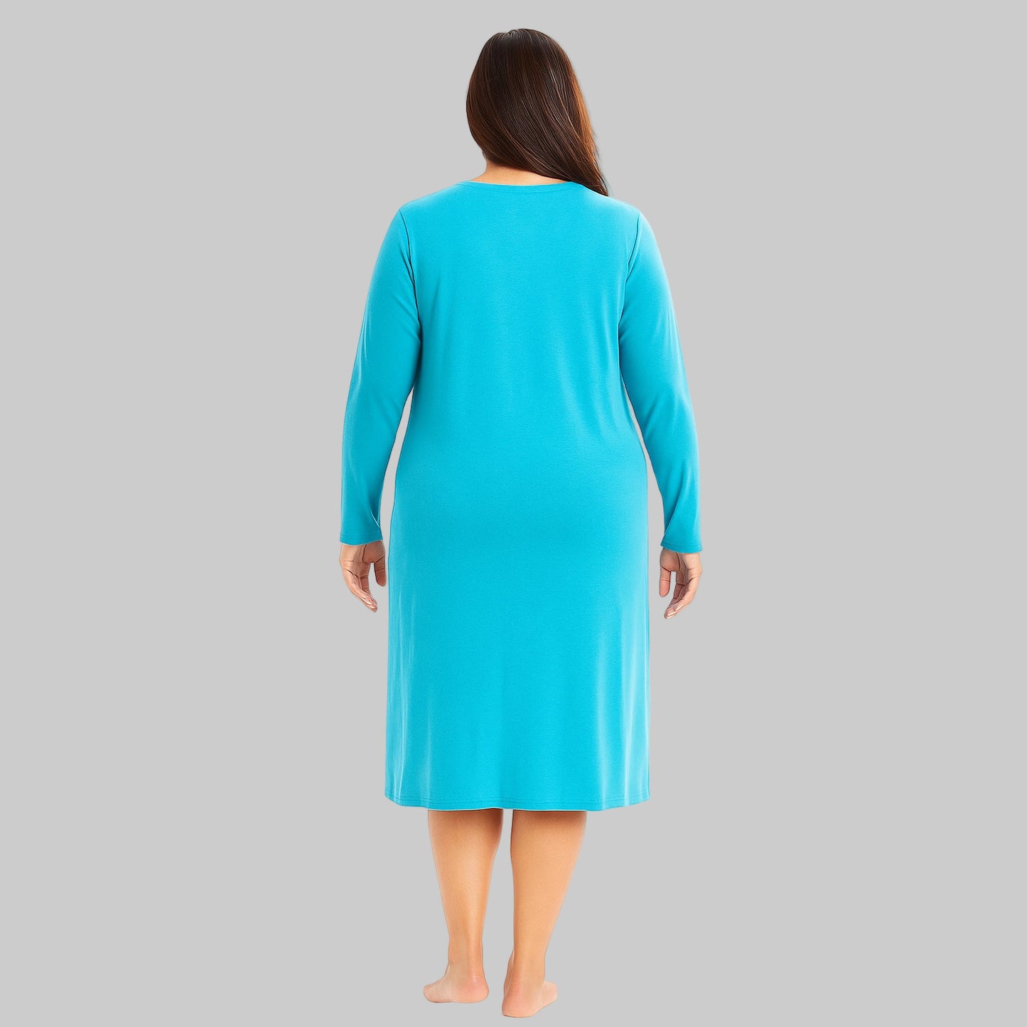 Plus-size woman wearing a Pool Blue Long Sleeve Sleepshirt, knee-length with long sleeves, made from soft cotton jersey, perfect for sleep and lounge.