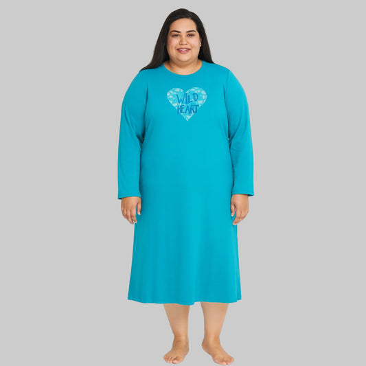Plus-size woman wearing a Pool Blue Long Sleeve Sleepshirt, knee-length with long sleeves, made from soft cotton jersey, perfect for sleep and lounge.