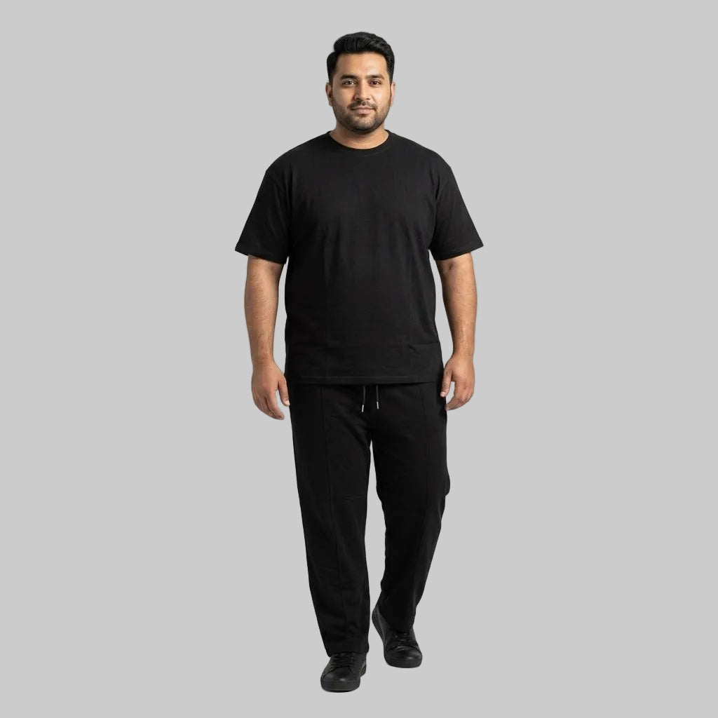 Premium black men's cotton jersey co-ord set featuring a matching short-sleeve T-shirt and comfortable bottoms for casual everyday wear.
