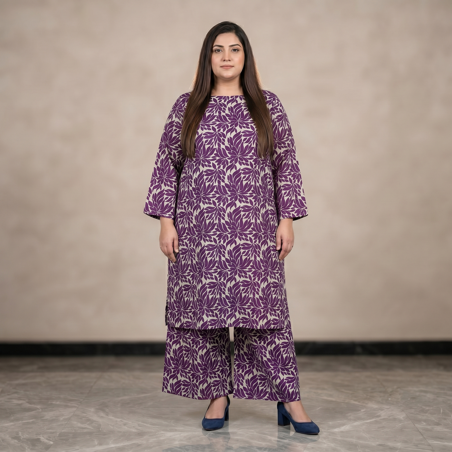 Woman wearing a purple floral dress against a neutral background