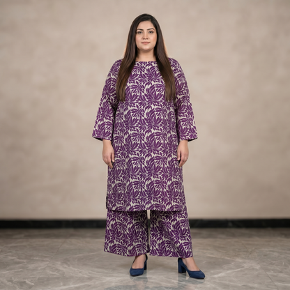 Woman wearing a purple floral dress against a neutral background