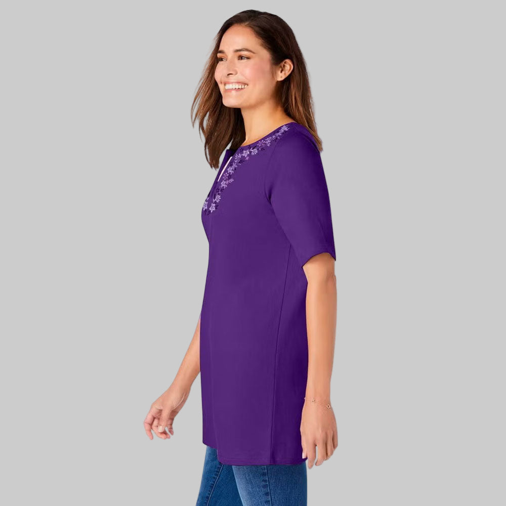 This plus-size 2-in-1 tunic makes layering effortless with a striped contrast inset & embroidered neckline. Relaxed fit, elbow sleeves & tunic length for comfort.
