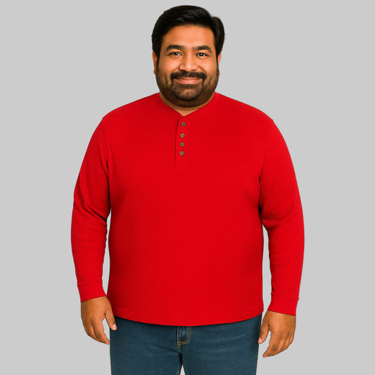 Model wearing red waffle-knit thermal Henley tee with ribbed cuffs and five-button placket on a plain white background.