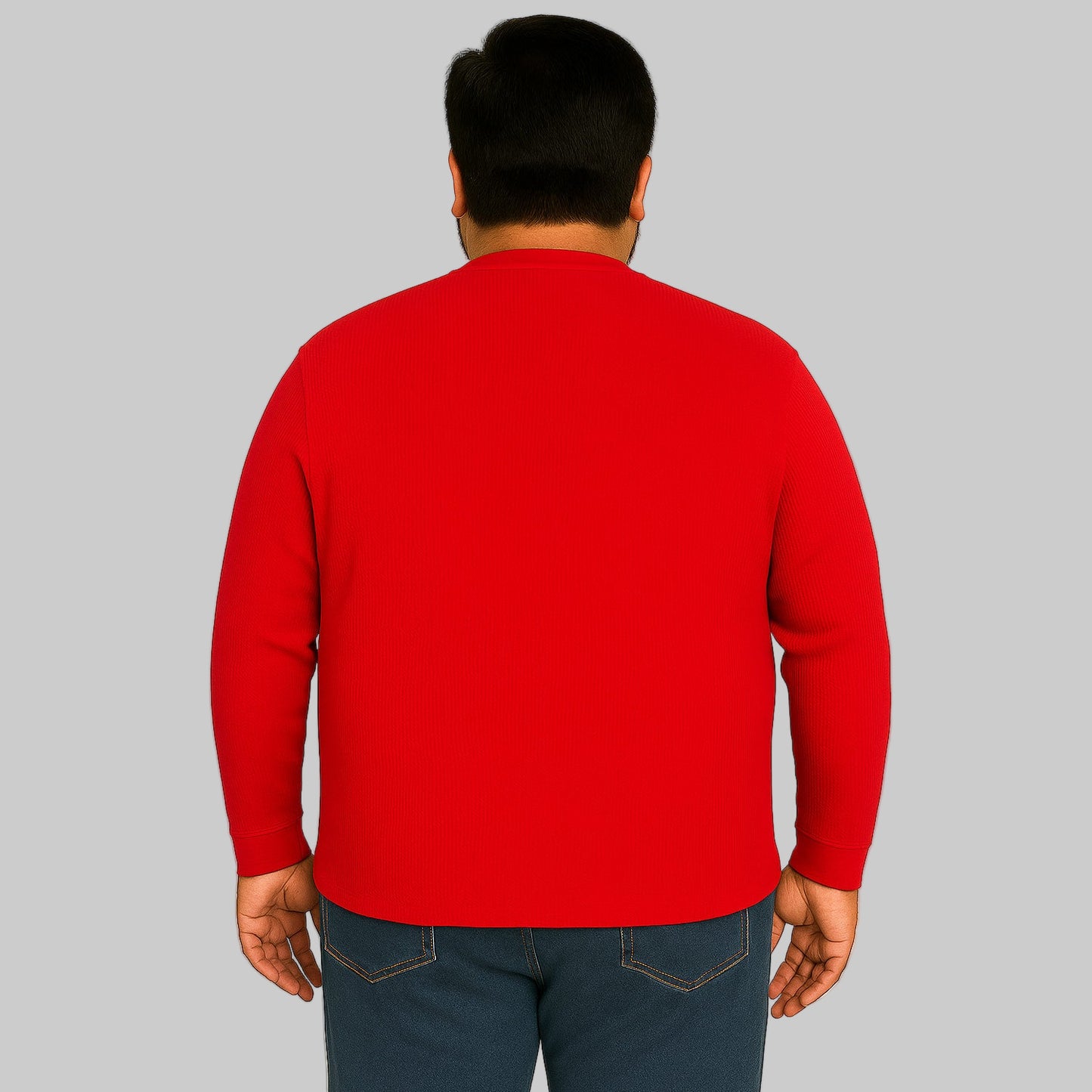 Model wearing red waffle-knit thermal Henley tee with ribbed cuffs and five-button placket on a plain white background.