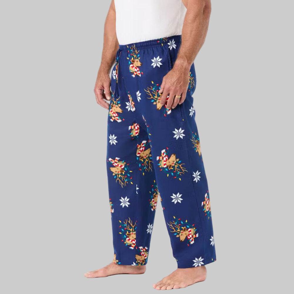 Men’s Reindeer novelty print flannel pajama pants with elastic waistband, drawstring, button fly, and side pockets.