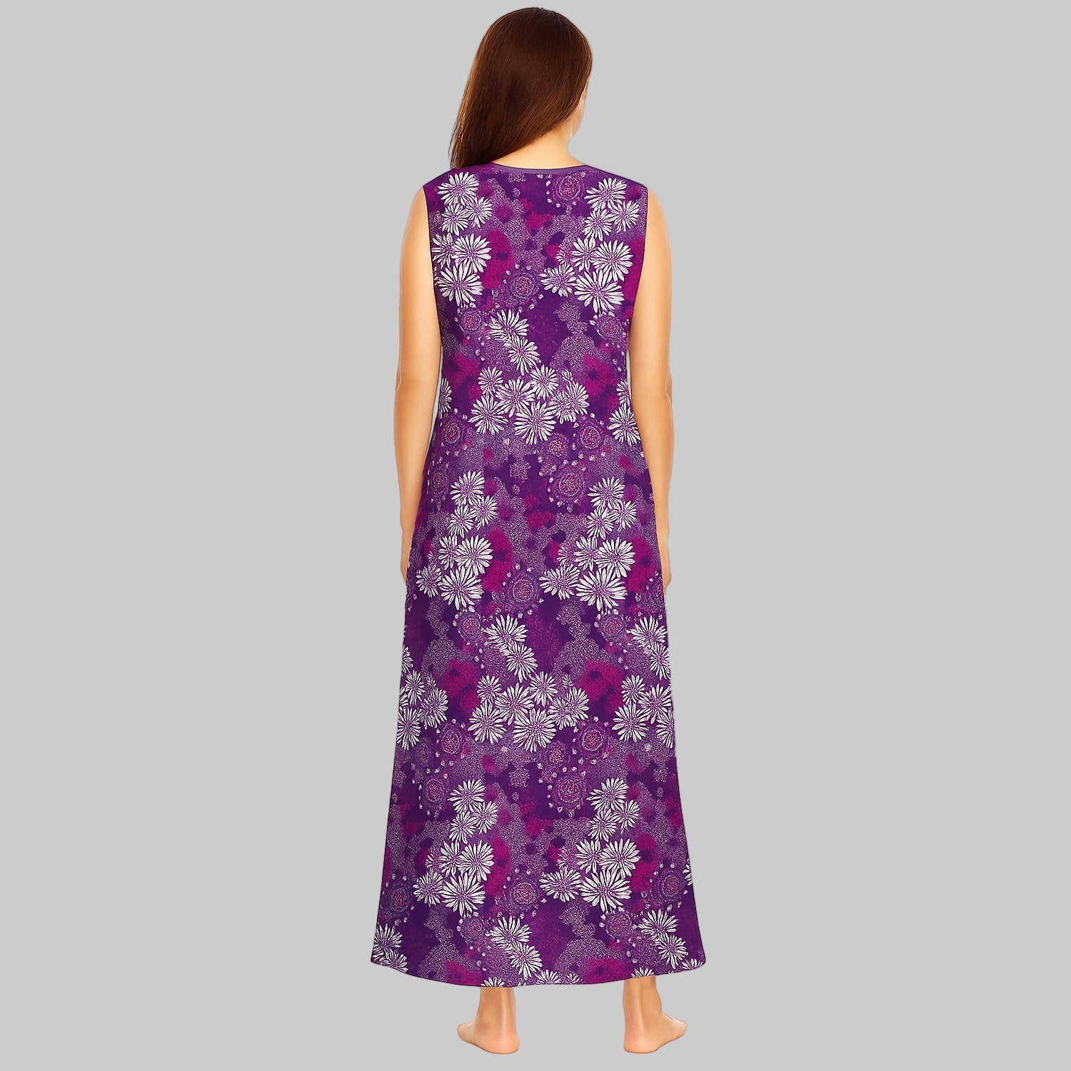 Plus-size woman wearing a rich violet floral sleeveless long lounger, mid-calf length, with V-neck and side pockets on white background.