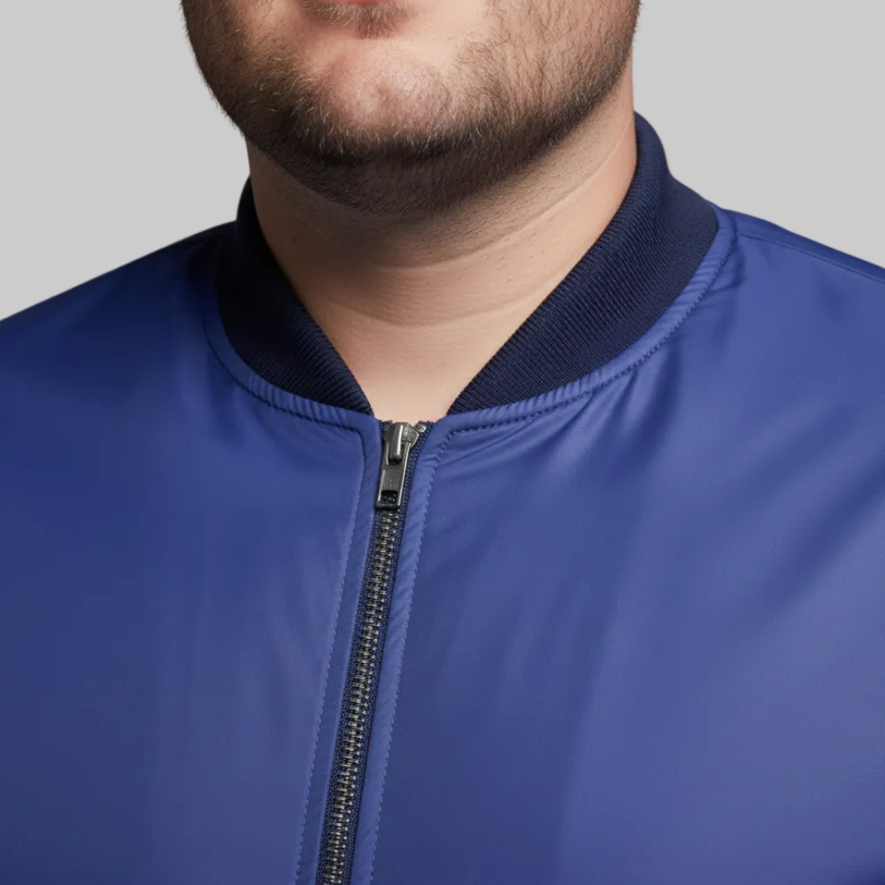Royal blue plus size bomber jacket with front zip closure and ribbed cuffs on a plain background.