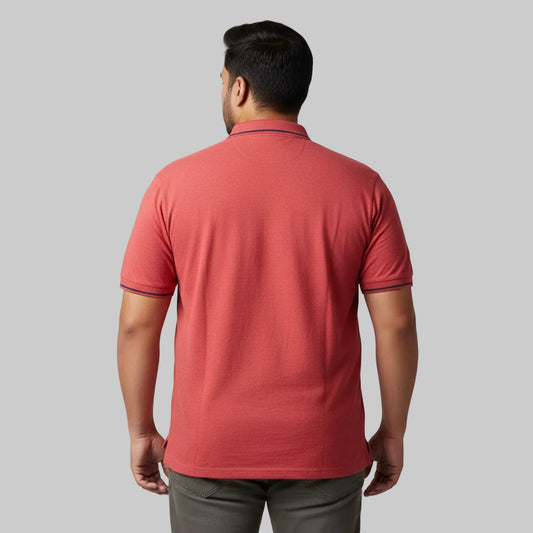 Rust red plus size polo shirt with contrast collar tipping and chest print laid flat showing front design and sleeve detail