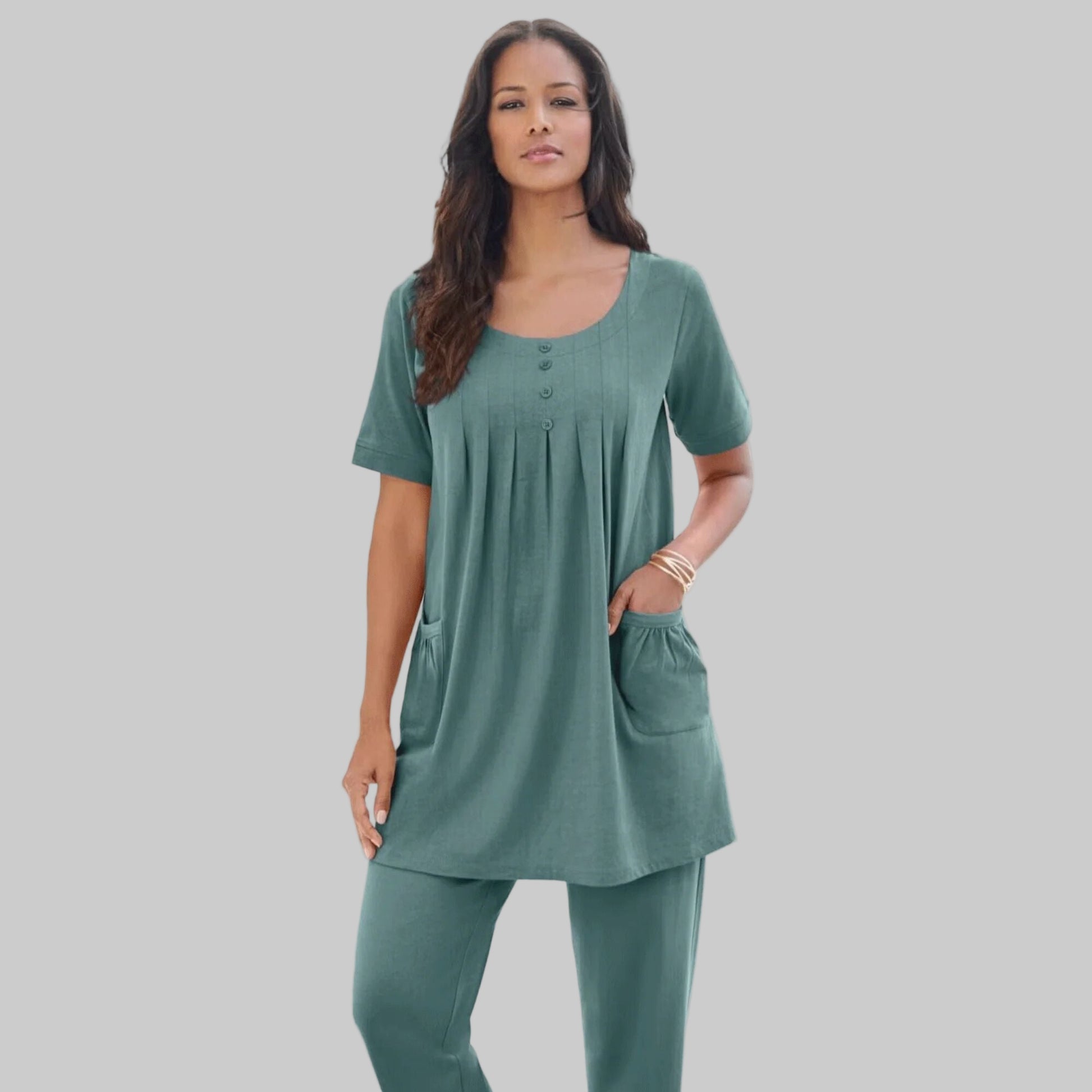 Sage Green Two Pocket Soft Knit Tunic with short sleeves, scoop neckline, and a relaxed fit for all-day comfort.