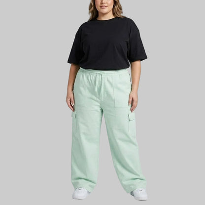 Seafoam Green Cargo Baggy Trousers in premium 98% cotton, 2% elastane twill dyed fabric featuring a relaxed baggy fit, elastic waistband, and utility cargo pockets.