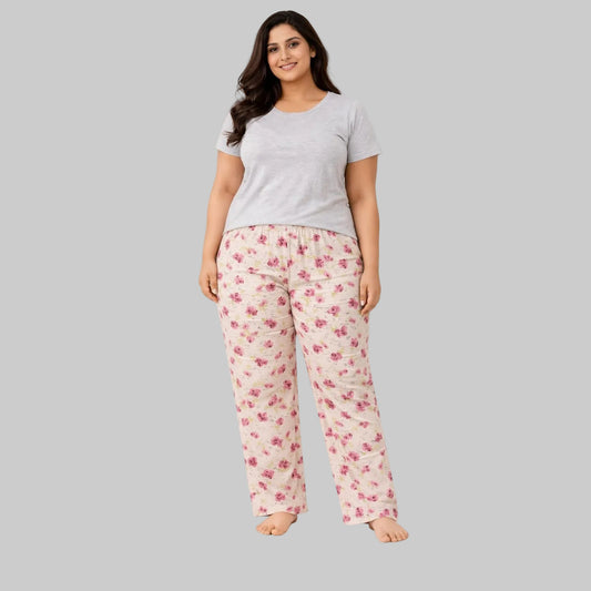 Beige flannel pajama pants with pink rose floral print worn by 2XL model