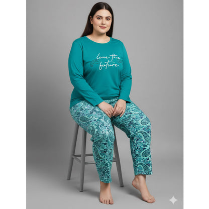 Plus-size woman wearing a teal long-sleeve pajama top with “Love the Future” print and teal paisley pajama bottoms — cozy cotton-blend sleepwear set.