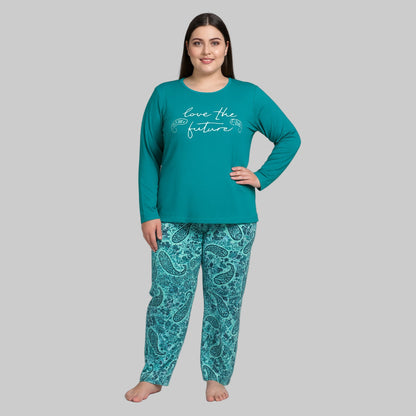 Plus-size woman wearing a teal long-sleeve pajama top with “Love the Future” print and teal paisley pajama bottoms — cozy cotton-blend sleepwear set.