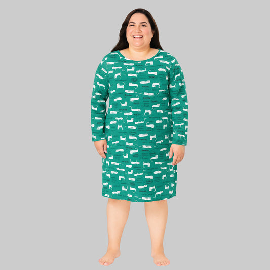 Plus-size woman wearing a tidal green printed long sleeve cotton sleepshirt, knee length, comfortable fit.