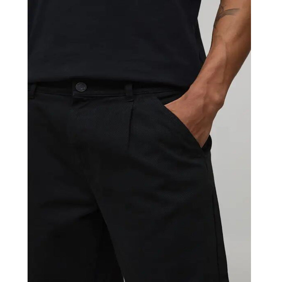 Men’s jet black wide-leg pants with relaxed fit and clean design