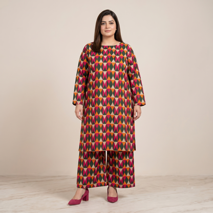Woman wearing a colorful patterned outfit on a plain background