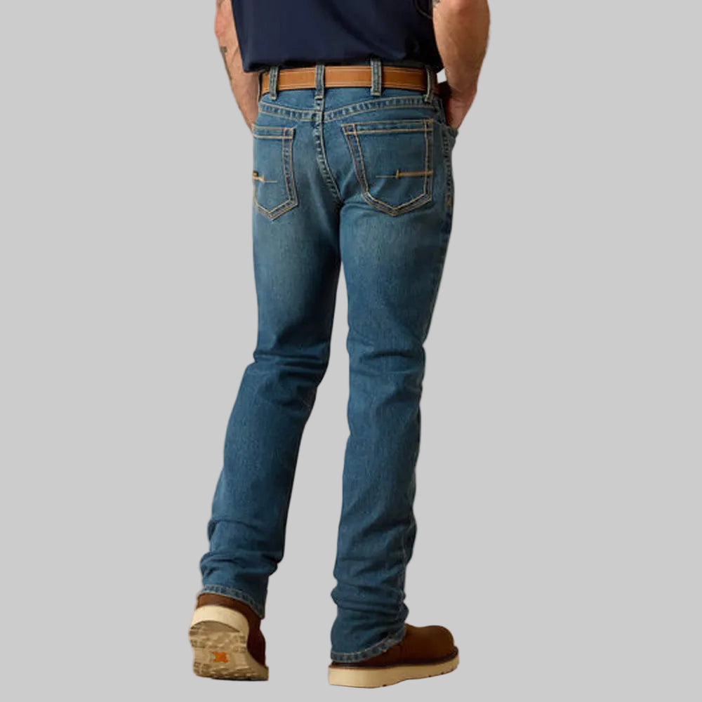 Vintage blue stackable straight leg denim jeans worn by a male model.