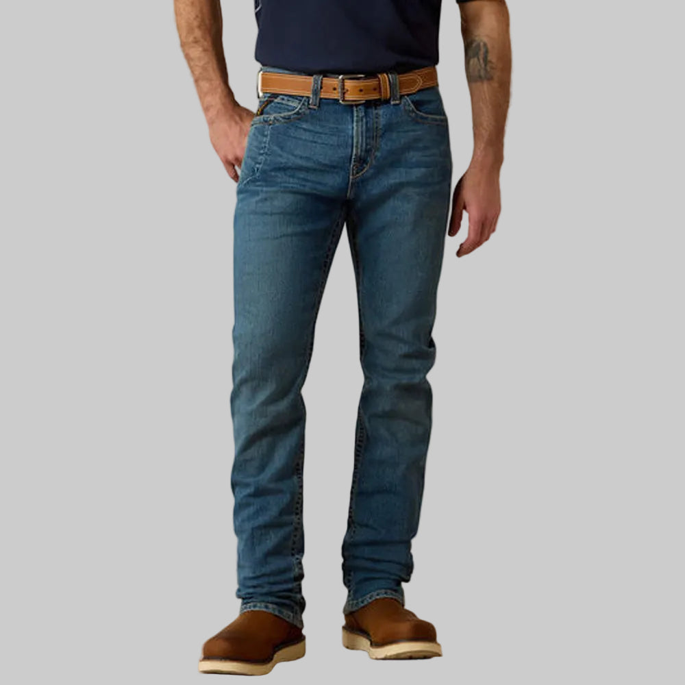 Vintage blue stackable straight leg denim jeans worn by a male model.