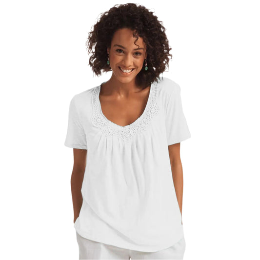 White cotton knit top with crochet-trimmed U-neck and pleated front design

