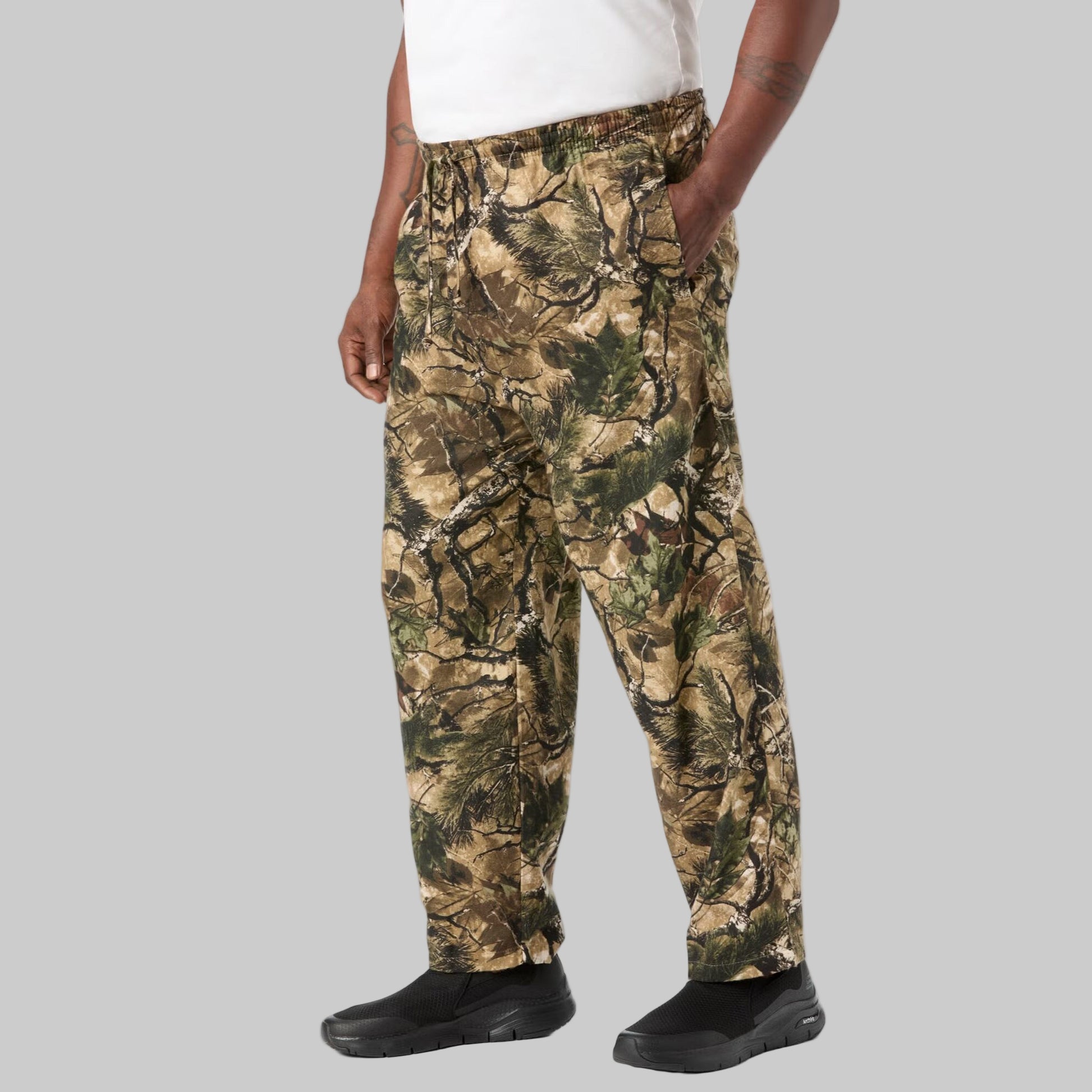 Men’s Wood Camo flannel pajama pants with elastic waistband, drawstring, button fly, side pockets, and camo print.