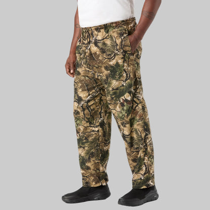 Men’s Wood Camo flannel pajama pants with elastic waistband, drawstring, button fly, side pockets, and camo print.