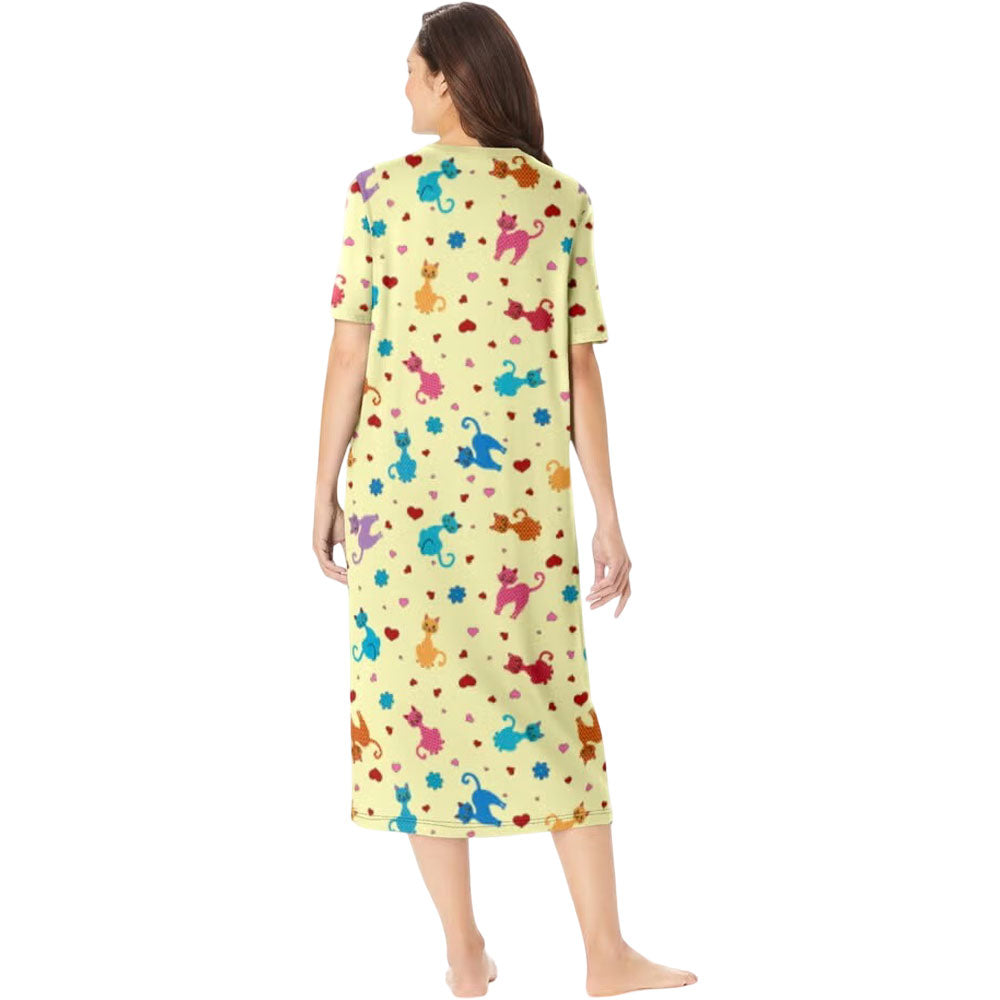 Plus size woman wearing yellow long sleepshirt with playful print
