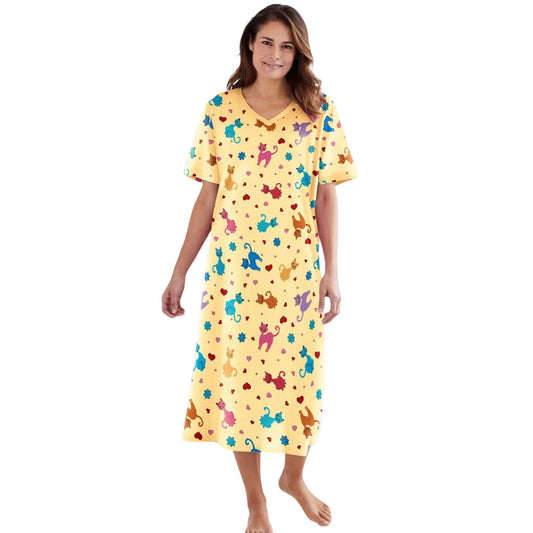 Plus size woman wearing yellow long sleepshirt with playful print
