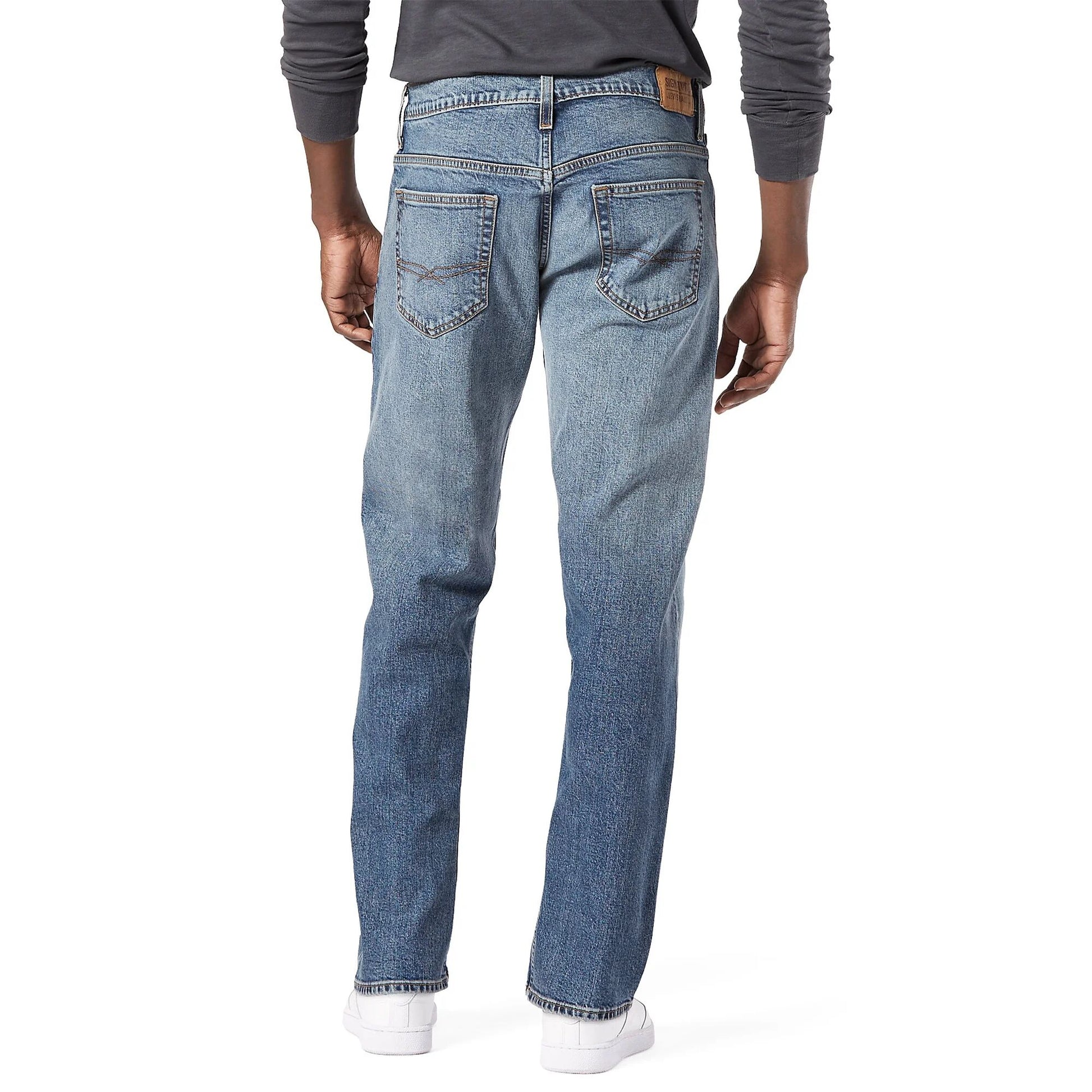 Full-length flat lay of Flying Strauss Signature Loose Fit Jeans in light wash