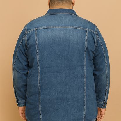 Plus-size man wearing classic blue denim jacket with button front and chest pockets