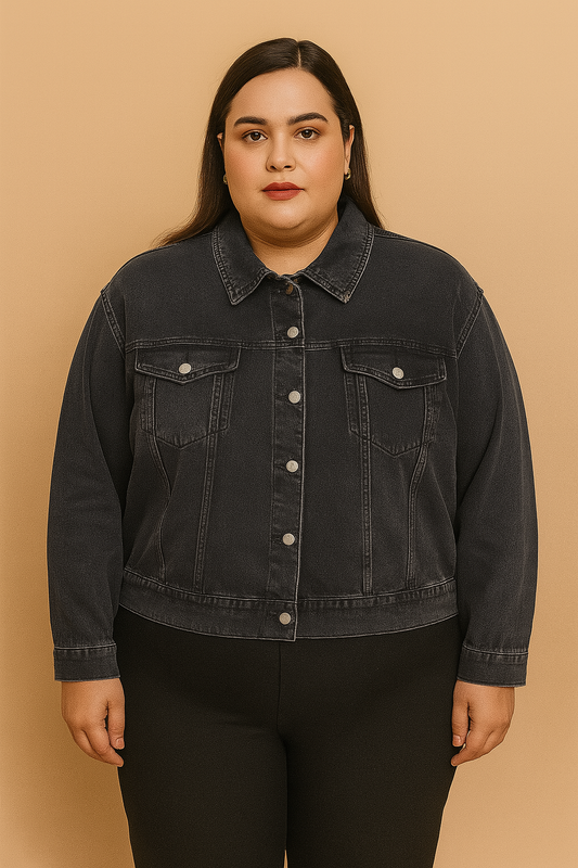 Plus-size woman wearing washed black denim jacket with button front and flap pockets