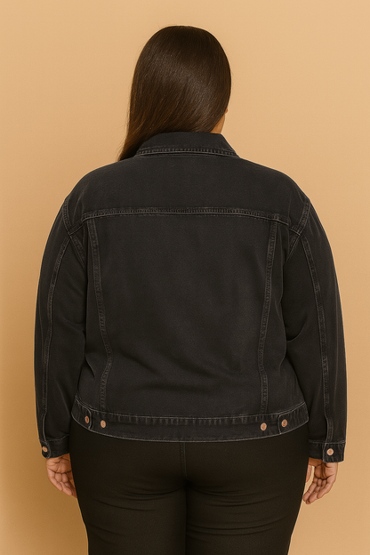 Plus-size woman wearing washed black denim jacket with button front and flap pockets