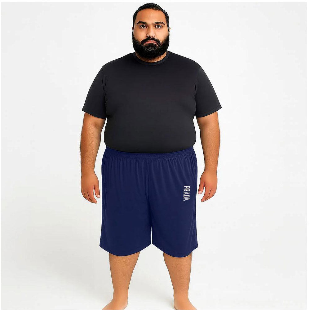 Man wearing navy Dri-Fit knit shorts with elastic waistband and relaxed fit