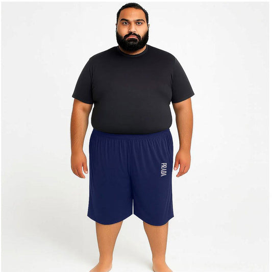 Man wearing navy Dri-Fit knit shorts with elastic waistband and relaxed fit