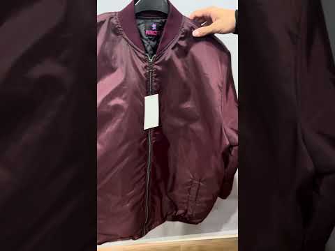 Maroon plus size bomber jacket with front zip closure and ribbed cuffs on a plain background.