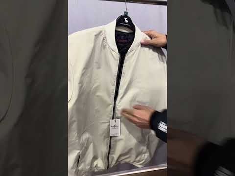Ivory plus size bomber jacket with front zip closure and ribbed cuffs on a clean background.