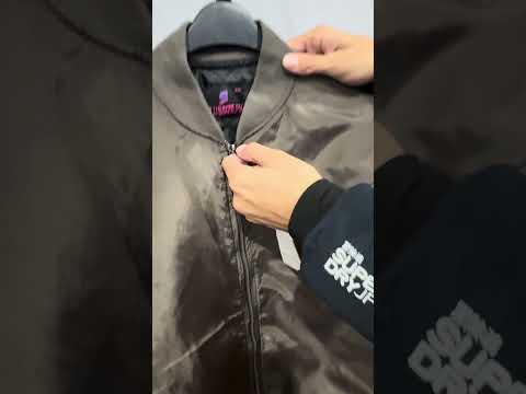Brown plus size bomber jacket with front zip closure and ribbed cuffs on a clean background.